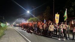 Aparat Polsek Ampana Kota Siaga Penuh Amankan Rute Pawai Obor Pramuka Touna